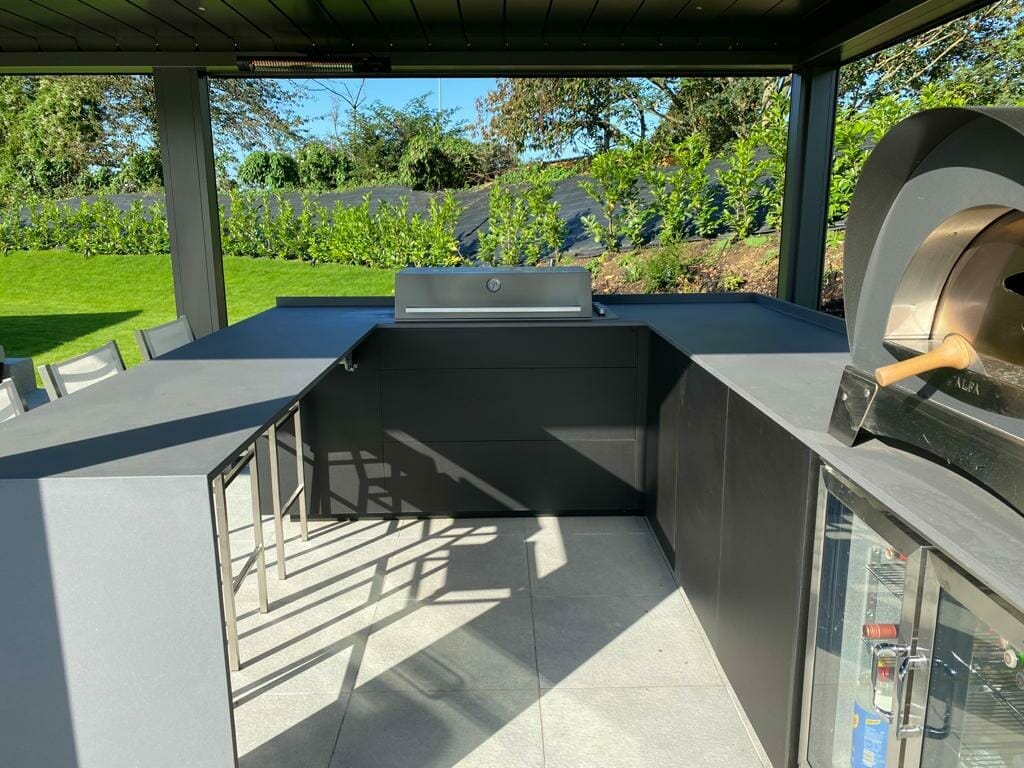 Modern Outdoor Kitchen Area With Pizza Oven and Beefeater BBQ